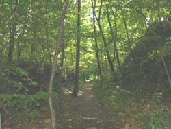 Mini-cliffs bordering the Rail Trail (photo by Webmaster)