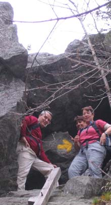 Dennis, Kristin, and Cheryl at the cave entrance at the top of the ladders on Morgan Cliffs (photo by Mark Malnati)