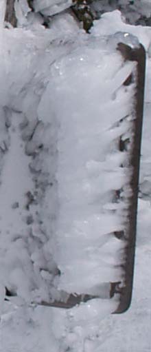 Horizontal icicles on the back of a trail sign (photo by Webmaster)