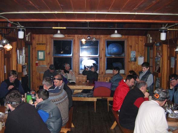 Relaxing in the main room of Zealand Falls Hut (photo by Mark Malnati)